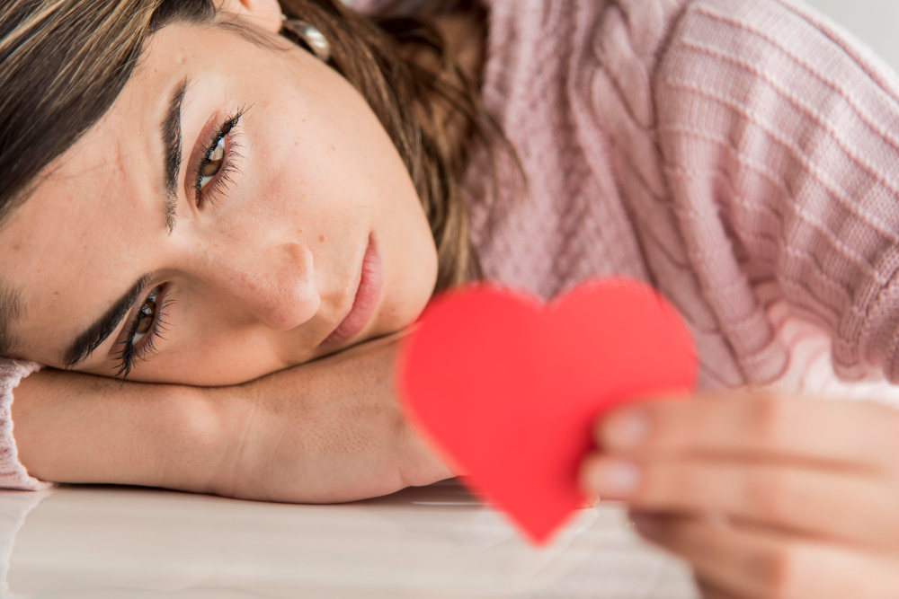 Woman holding a paper heart