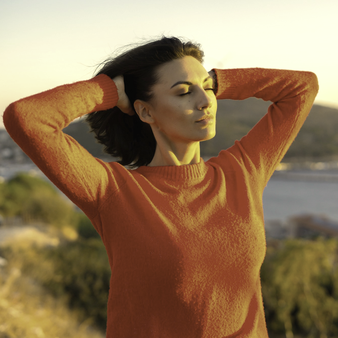 Serene woman at sunset